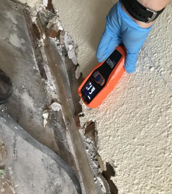 The Person checking flor damage with a device at San Marcos, CA